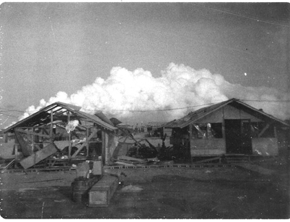 Tom thought this hooch was where Stephen Mueller was killed by a mortar round.  I don't think so... this looks more like one of the hooches along the flight line.  I recall the Tech Supply hooch took a direct hit by a NVA 122mm rocket, but it was more damaged than this hooch.   Therefore, the cloud formation in the distance may indicate this was the result of the typhoon that came in the Chu Lai area.